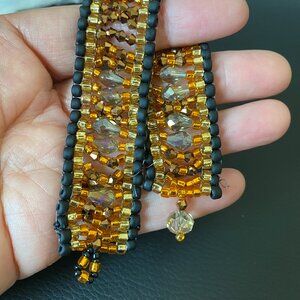 Sparkles with Colors of Ambers, Golds, and Copper Framed with Matte Black
